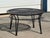 Offered is a Vintage Woodard Style Outdoor Wrought Iron Round Coffee Table. This classic patio tables features a black...