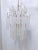 This is a vintage Murano chandelier with silver frame and hand blown glass tubes. Made by Sciolari during 1970's. It has 6...