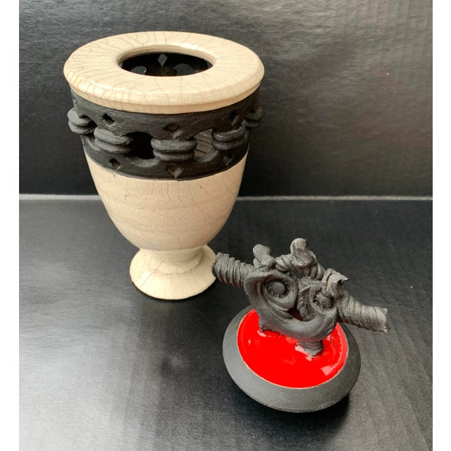 Wonderful vintage handmade raku pottery vessel with elaborate ornamental top stopper lid by Jinsong Kim. Traditional black...