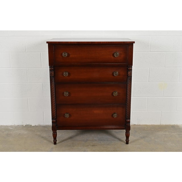 A gorgeous American Empire style four-drawer highboy dresser or chest of drawers By Kindel Furniture USA, Circa 1960s...