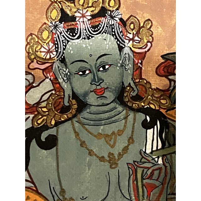 An authentic antique Tibetan Buddhist thangka depicting Green Tara, dating to the Qing Dynasty, late 18th to mid-19th...