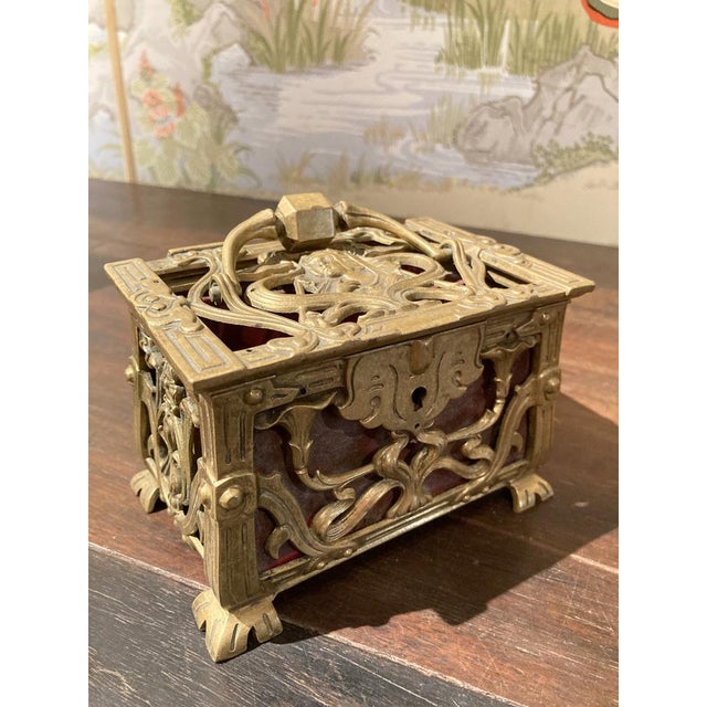 This lavish French Art Nouveau period (1880-1910) jewelry box is entirely chiseled, hammered and pierced with flowers and...