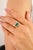 Crafted in luminous 14k yellow gold, this elegant ring showcases a captivating 1.06-carat emerald-cut emerald at its...