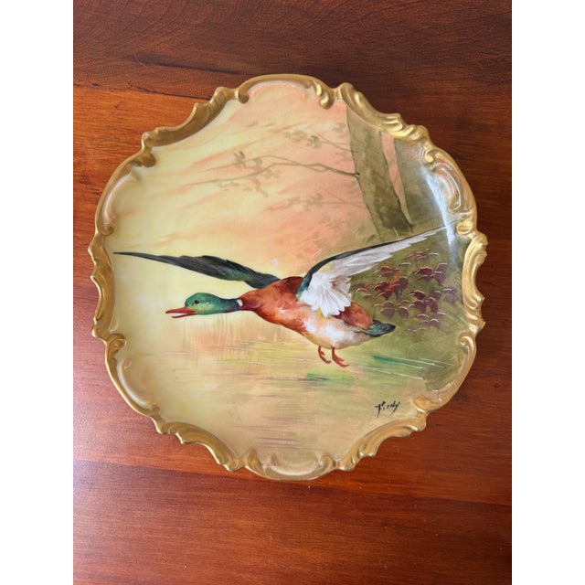 ring timeless French sporting elegance to your collection with this exquisite hand-painted Limoges Coronet porcelain...