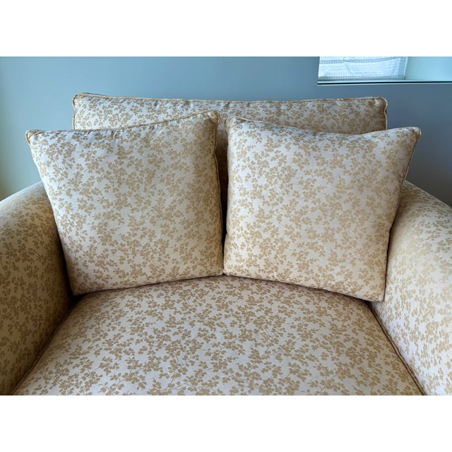 A soft buttery yellow chinoiserie fabric covers this one and half size easy chair. Elegant rolled arms and skirt add...