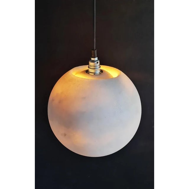 Planet lamp by roxane lahidji dimensions: d 25 x h 25 cm material: marbled salts a unique award-winning technique...