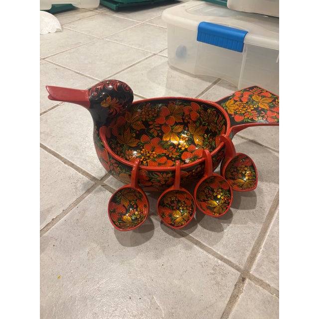 Wooden duck khoklomah painted with a berry and floral design black, gold, and red design. Perfect for any collectors...