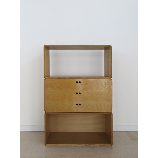 Samara series bookcase container composed of three modular elements in ash wood, including two open containers and a chest...