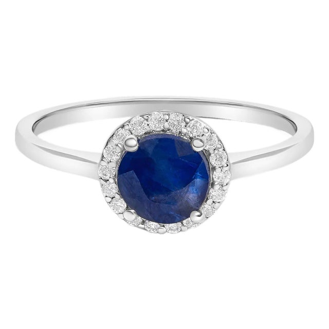 10K White Gold Blue Sapphire and 1/10 Cttw Diamond Halo Ring For Sale