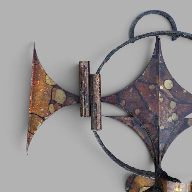 A striking Danish Brutalist wall sculpture and candle holder by Henrik Horst, dating from the 1970s. The hand-worked metal...