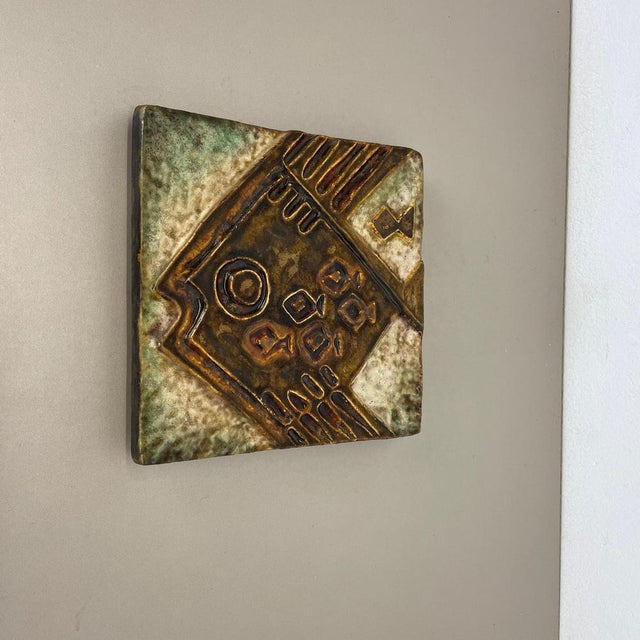 This original vintage ceramic wall plate with abstract hand-painted and colorful illustrations of a fish. This fantastic...