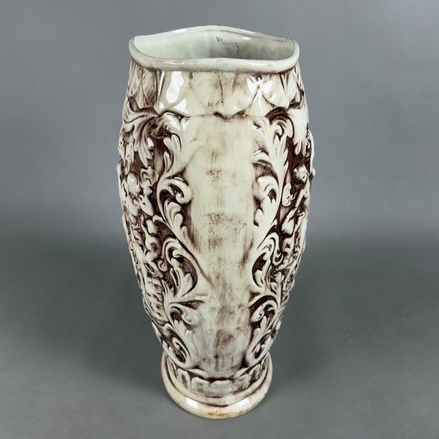 An imposing and dramatic high-relief glazed ceramic decorative vase, attributed to Italian artistic craftsmanship from the...
