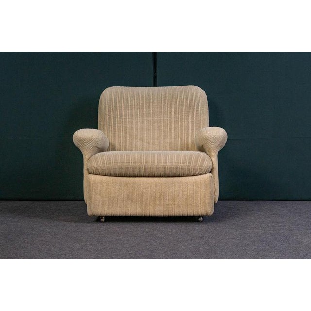 Product. Armrest chair style. Mid-century · 1970s equipment. An armchair on wheels material. Beige upholstery fabric ·...