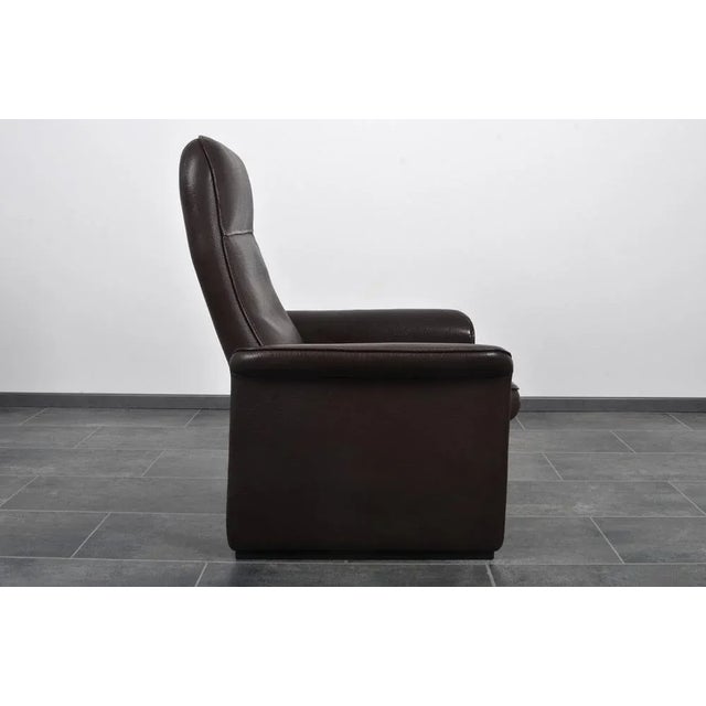DS-50 Cigar Brown Neck Leather Chair from de Sede, in Flawless conditions. Designed 1980 to 1989 This piece has an...