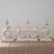 Mid Century Modern plaster table lamps of stylized seated lady in cream from the 1950's. The partial body front and hair...