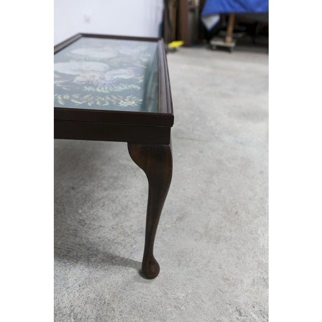 Mahogany coffee table from the 1940s made by Needlewoman Shop London. Embroidery under original glass representing hens...
