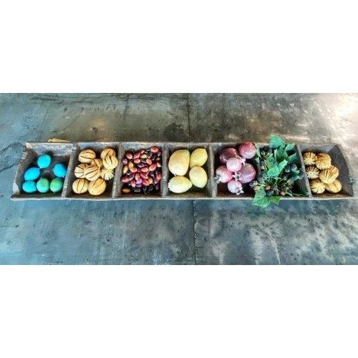 Fantastic antique primitive trough with 7 compartments filled with faux berries, nuts and fruits. Dimensions: 47" L, 8...