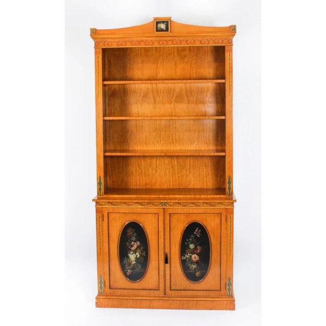 This is a beautiful antique Sheraton Revival top quality open bookcase, masterfully crafted in rich satin wood with...