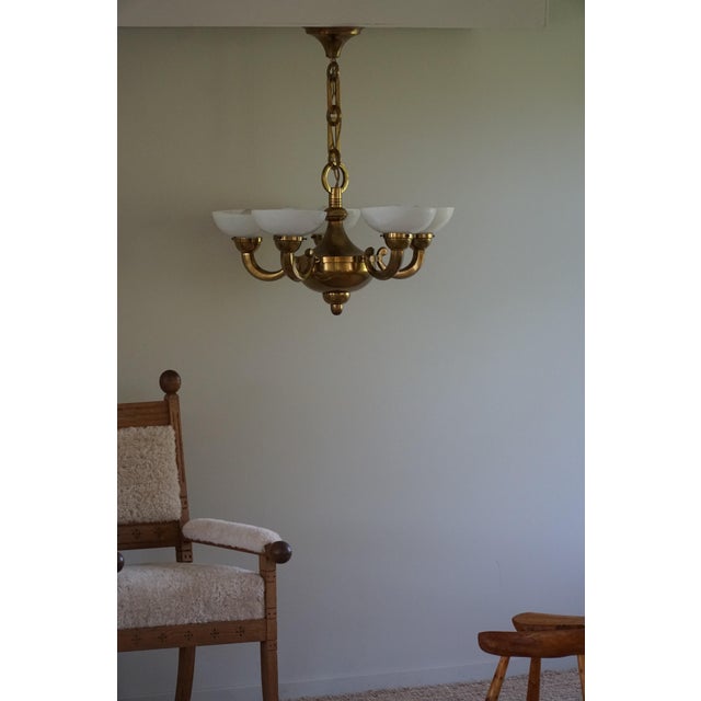 A truly beautiful Art Deco chandelier made in brass and glass. Crafted in Denmark during the mid-20th century, this...