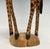 A striking piece of African folk art, this hand-carved hardwood giraffe stands approximately 23.5” tall and commands...