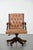 This attractive English-style, cowhide and wooden Chesterfield office chair is a timeless addition to any office. It...
