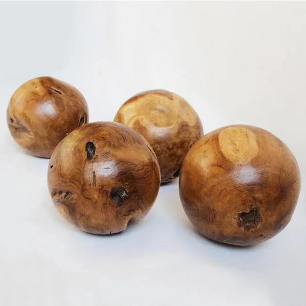 Tumbled round teak root spheres with hand wax finish. Interesting design element and shape. Each is unique. Wood grain and...