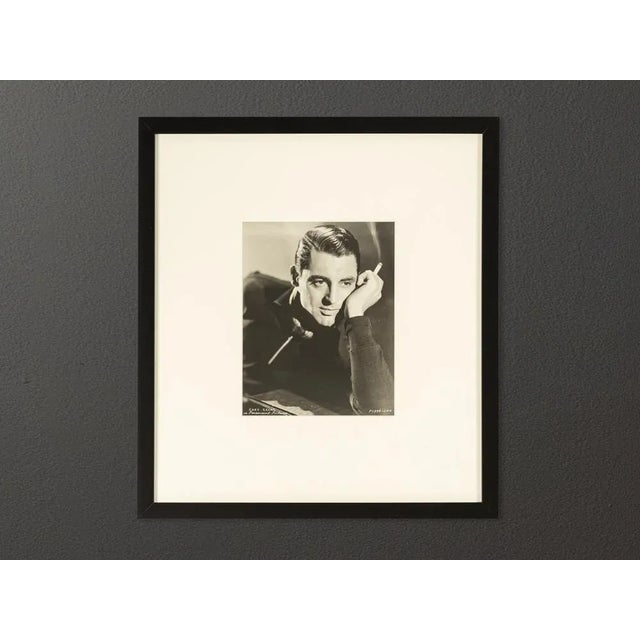 Original vintage portrait of Cary Grant from the 1930s. The Paramount Studios Portrait shows a youthful presentation of...