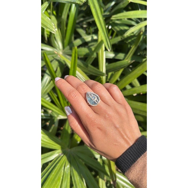 A very gorgeous and beautiful, modern style, Aquamarine Cocktail Ring set in 18K Yellow Gold & natural Diamonds. The...