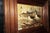 A charming handcrafted wildlife diorama featuring two beautifully detailed Canada geese surrounded by natural woodland...