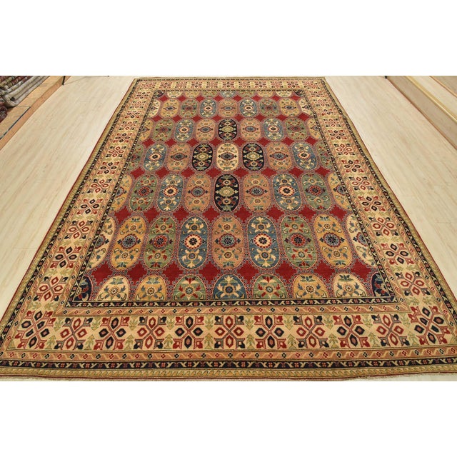 This traditional Caucasian Kazak rug is hand-knotted with an all-wool pile on a cotton foundation. This rug is new and in...