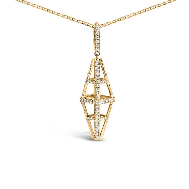 Indulge in the sheer brilliance of the 14K Yellow Gold Diamond Studded Geometric Double Pyramid Necklace, a testament to...