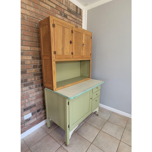 Bring a piece of early 20th-century history into your home with this authentic Sellers Kitcheneed Cabinet. Manufactured by...