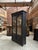 This antique black patina display cabinet has been fully restored. It has two large glass doors with their original bubble...