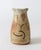 Vintage studio art pottery water pitcher in earth tones. Signed by the artist on bottom. Minor age wear. No chips or cracks.