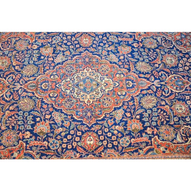 An amazing early 20th century Persian Kashan rug with an intense densely woven all-over large and small-scale floral and...