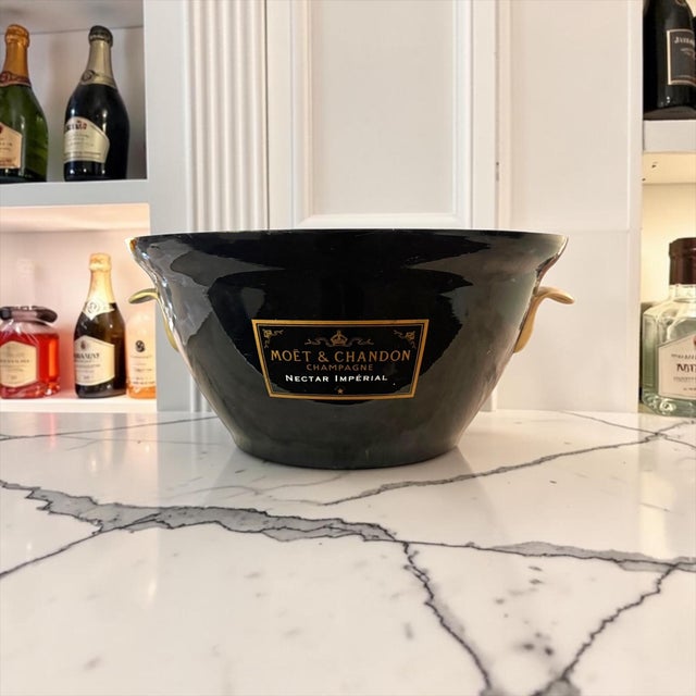 A striking and difficult-to-find Moët & Chandon Nectar Impérial champagne cooler finished in dramatic black with gold-tone...