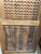 Bring artistic detail and the warmth of natural wood into your home with this hand-carved teak wood barn door, featuring a...