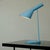 This iconic Scandinavian modern vintage AJ table lamp was produced in Denmark by Louis Poulsen It features a blue...