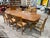 This Emerson Heirlooms dining table with eight coordinating chairs exemplifies classic American craftsmanship and timeless...