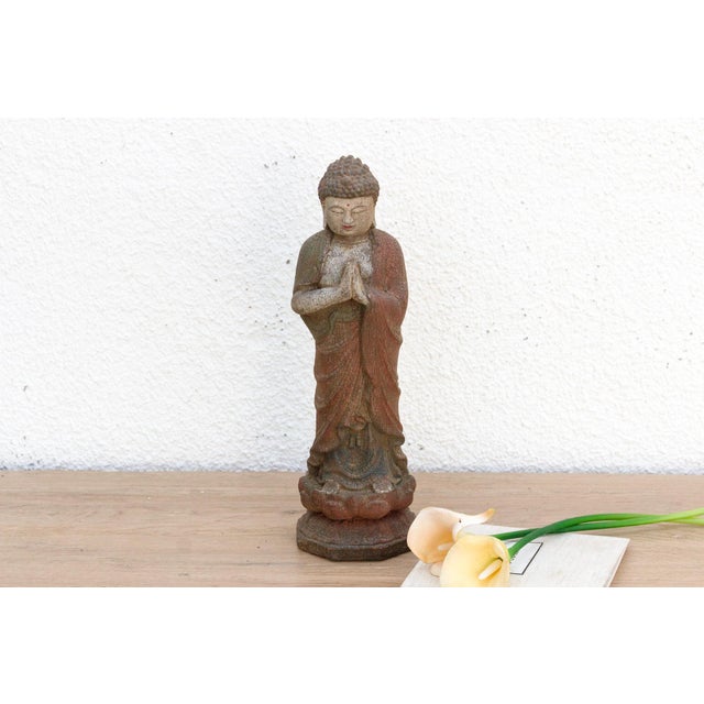 Discover the serene beauty of a peaceful, contemplative moment captured in wood with this charming petite carved and...