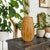 Elevate your home decor with this Rustic Orange Ceramic Fluted Texture Table Vase, a stunning piece that combines...