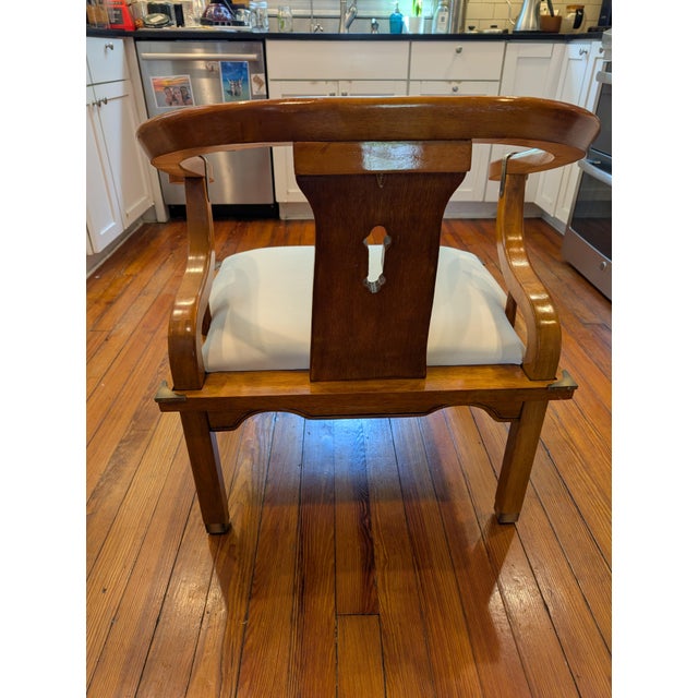 A stunning mid-century James Mont style solid wood horseshoe Asian-inspired lounge chair made by Schnadig Furniture in...