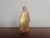 Small baroque figure of a saint, made of wood, covered with gold leaf. The figure is in its unrestored original condition...