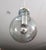 Beautiful Bulb pendant lamp by Raak. Amsterdam, Netherlands, 1970s. Metal frame supporting a stunning blown-glass globe in...