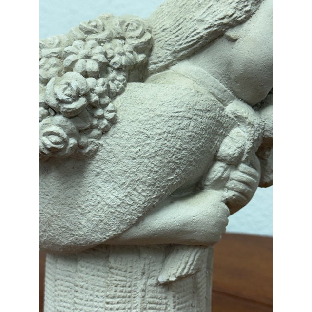 Design Plus Gallery presents a Vintage Flower Bearer Figural Sculpture. This sculptural plaster piece depicts a serene...