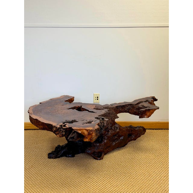 We are very pleased to offer this monumental redwood burl live edge sculptural coffee table, USA, circa 1970s. This...