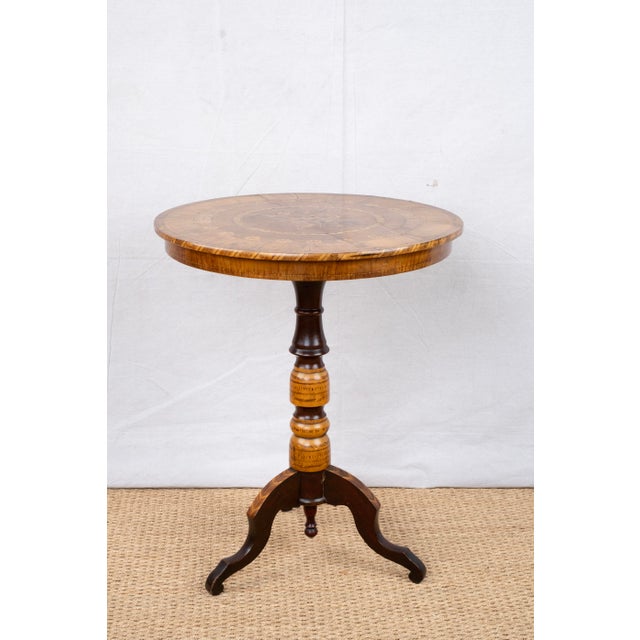 An antique marquetry tripod table with marquetry top, c. 1880, Italian. Also known as a Sorrento table an likely made...