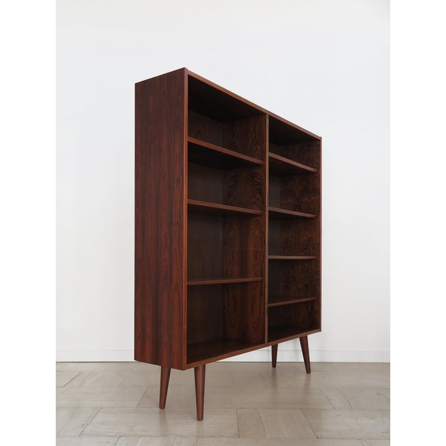 Scandinavian midcentury modern design dark wood bookcase designed by Gunni Omann and produced by Omann Jun Møbelfabrik in...