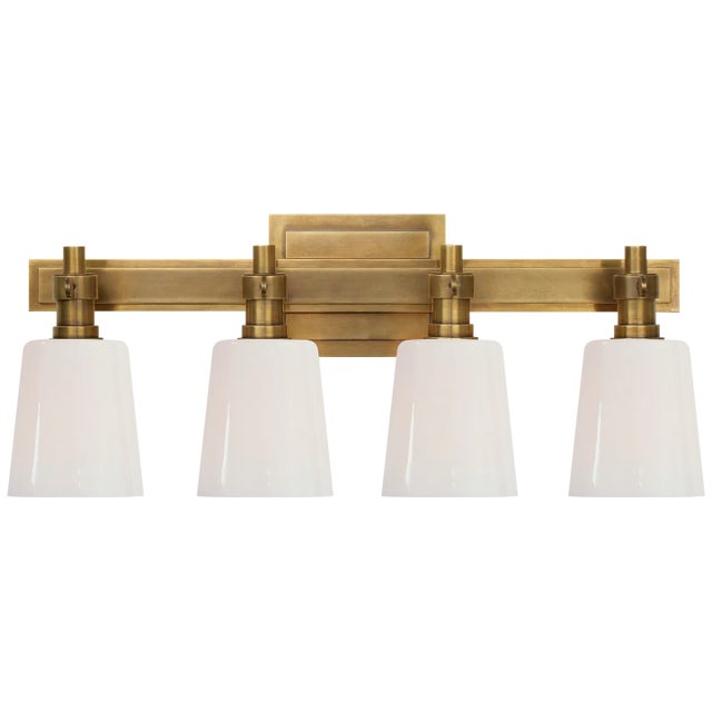 Thomas O'Brien for Visual Comfort Signature Bryant Four-Light Bath Sconce in Hand-Rubbed Antique Brass with White Glass For Sale