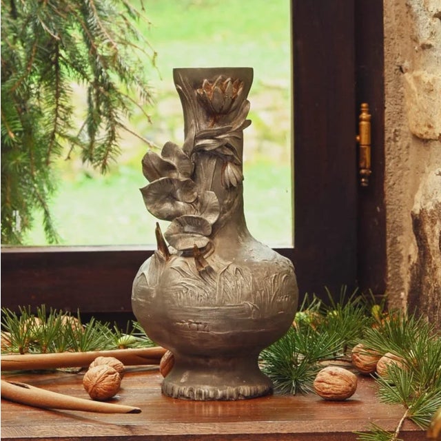 Vintage Art Nouveau figural vase in metal – a stunning decorative piece crafted in early 20th-century style, this vase...